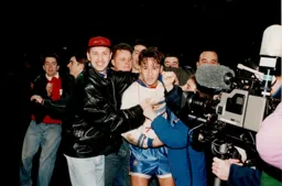 TV cameras focus in on Scott Oakes as he is mobbed by happy supporters