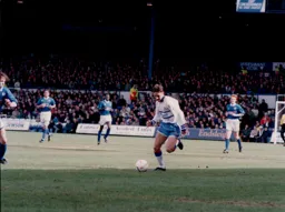 Scott Oakes brings the ball forward