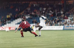 Marvin Johnson chips the ball forward