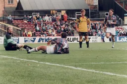Goals scorer Telfer is about to be congratulated by Scott Oakes