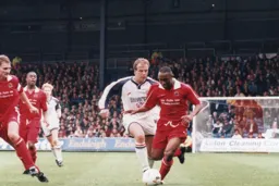 Kerry Dixon puts pressure on the City defence