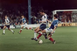 Scott Oakes tries to ride a Pompey tackle