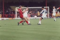 Julian James and Des Linton block Swindon's Keith Scott