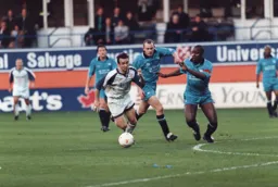 Paul Allen in a race for the ball