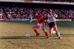 Kerry Dixon puts pressure on a Barnsley defender