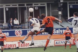 Kerry Dixon flicks the ball on with his head