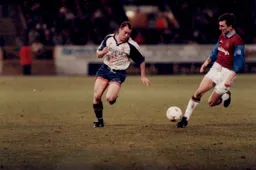 Rob Matthews skips past a Burnley defender