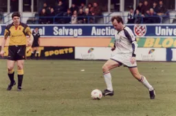 Watford's Mick Quinn can only admire the passing skills of Trevor Peake