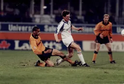 John Taylor is tackled by Dean Richards