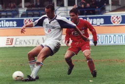 Des Linton shields the ball