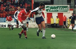John Taylor shields the ball