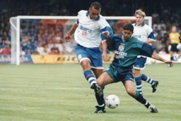 Des Linton clips the ball forward