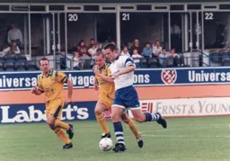 Steve Davis comes out of defence with the ball