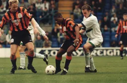 Dwight Marshall holds off Tranmere's John McGreal leaving David Oldfield ready to get away with the ball