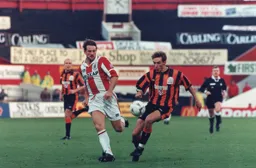 Vidar Riseth in a battle with Stoke's Vince Overson