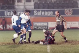 Three Luton players appear to miss the ball