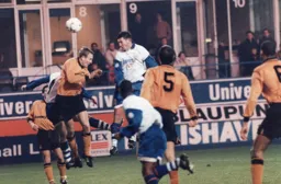 Paul McLaren gets his head to a corner