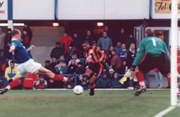 Dwight Marshall tries a shot in a rare Luton attack