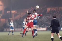 Richard Harvey wins his header