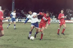 Des Linton tries to clip the ball down the line