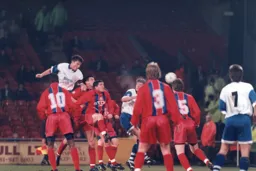 Steve Davis rises above everyone to send a header wide