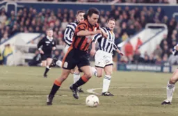 Bontcho Guentchev shows the Albion defenders a clean pair of heels