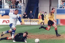 Kim Grant rounds the goalkeeper but fails to find the net