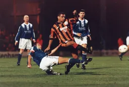 Kim Grant wins this battle of the Hatters but no goal this time