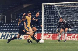 Tony Thorpe battles away as the Town record another shock, holding Premiership Wimbledon to a draw away from home
