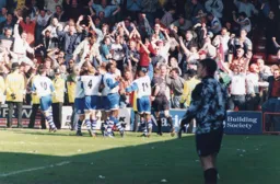 The Town players celebrates goals by Kiwomya and Davis but unfortunately lose for the first time in seven