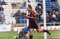 Andrew Fotiadis celebrates his winning goal in a 1-0 win but results elsewhere means Luton are condemned to the play-offs
