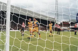 Thorpe and Alexander celebrate Tony's penalty that gives the Town a half time lead