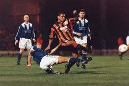 Kim Grant wins this battle of the Hatters but no goal this time