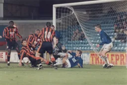Goalmouth scramble at the Den