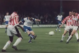 Ceri Hughes fires in a stinging shot towards the Bees goal