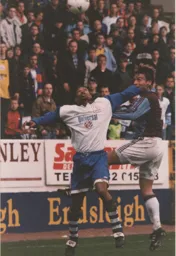 Dwight Marshall wins the ball in front of the Town_s travelling faithful
