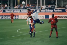 Dwight Marshall in a heading duel with Nathan Jones