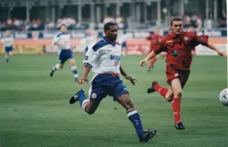 Dwight Marshall in a race for the ball with Nathan Jones