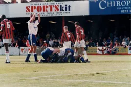 Somewhere at the bottom of the pile is goal scorer Dwight Marshall
