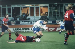 Paul McLaren is fouled by Paul Holmes