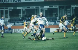 Simon Davies gets past a desparate challenge