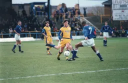 Paul McLaren`s way through is blocked by Roger Willis