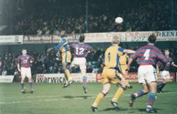 Mitchell Thomas wins a header as Town press for a late equaliser