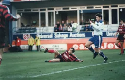 Paul McLaren looks as though he is about to commit a handball offence