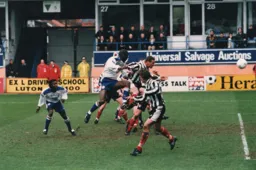 Mitchell Thomas powers a header towards goal