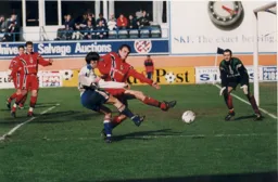 Rory Allen goes close despite the attention of Mark Tinkler