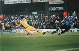 Rory Allen at full stretch just fails to make contact with the ball