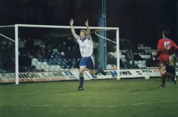 David Oldfield arms aloft celebrating after scoring the third goal