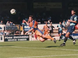 Phil Gray with a flying header