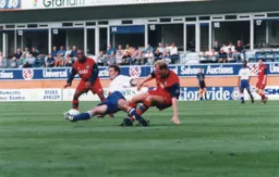 Phil Gray is bought down as he tries to hold on to the ball